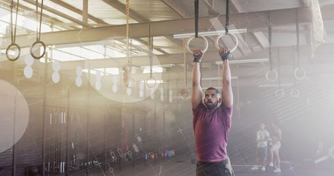 Man Engaged in Gym Ring Workout with Digital Interface Overlay - Download Free Stock Images Pikwizard.com