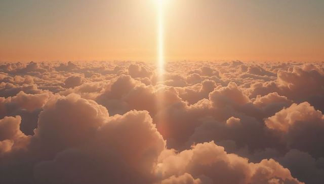 Sunlit golden clouds with radiant vertical sunbeam at high altitude