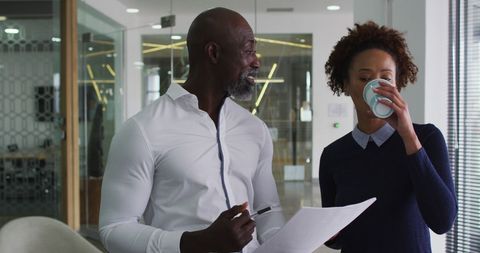 Business Colleagues Discussing Work in Modern Office