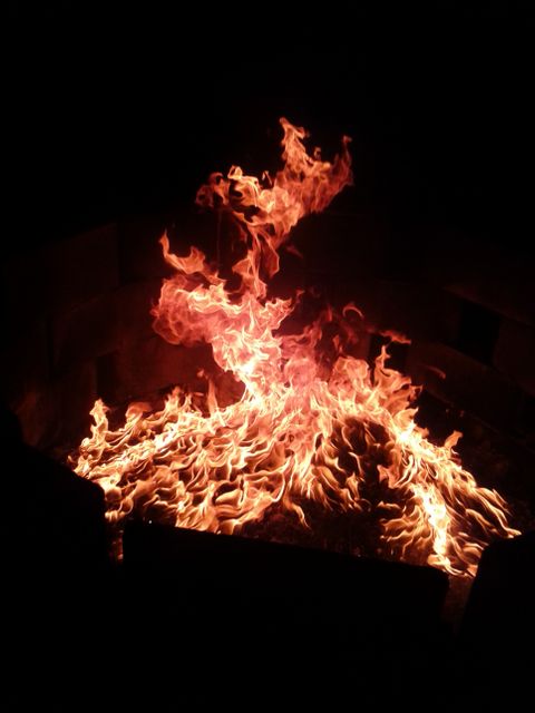 Raging Bonfire Ember Flames in Darkness - Download Free Stock Photos Pikwizard.com