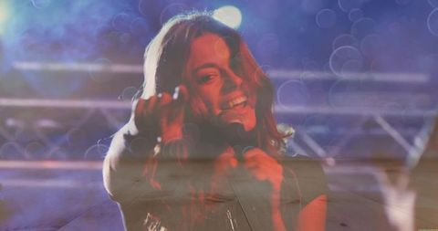 Energetic female singer performing live on stage