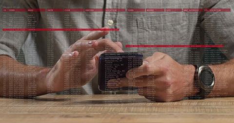 Man tapping smartphone with stylus over code overlay, smartwatch-wearing hands on desk