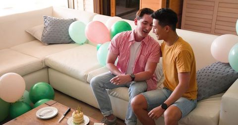 Joyful LGBTQ+ Couple Celebrates Birthday at Home with Gifts