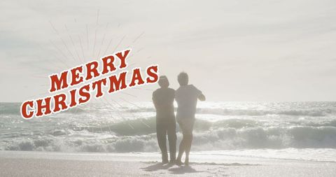Senior Couple Celebrating Christmas on Tranquil Beach