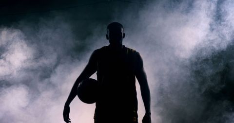 Silhouette of Basketball Player in Smoky Basketball Court - Download Free Stock Images Pikwizard.com