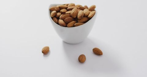 Almonds in White Bowl on Clean Surface - Download Free Stock Images Pikwizard.com