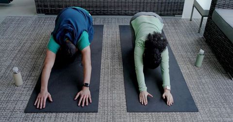 Diverse People Practicing Yoga Poses Indoors for Relaxation and Wellness