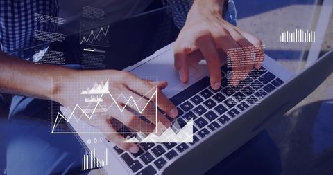 Man analyzing digital data on laptop with graphical overlays