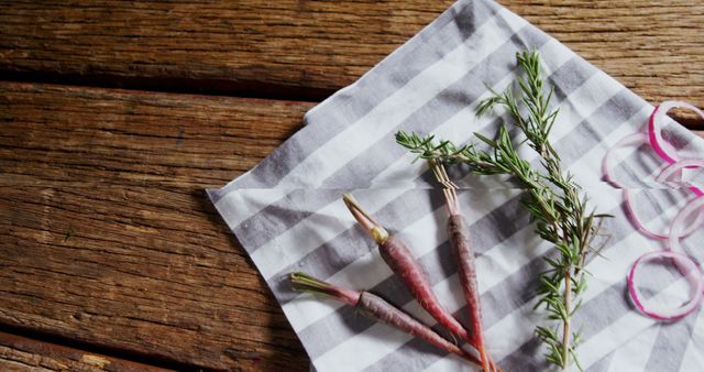 Fresh Rosemary and Baby Carrots on Striped Cloth - Download Free Stock Images Pikwizard.com