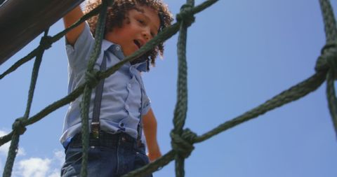 Young Boy Climbing Playground Equipment in Summer - Download Free Stock Images Pikwizard.com