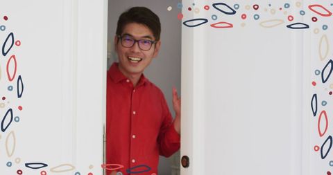 Festive welcome with smiling man in red shirt