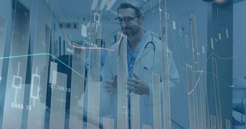 Doctor with digital chart overlay in hospital hallway