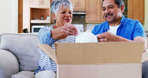 Couple Unpacking Box Signaling New Beginnings Together - Download Free Stock Images Pikwizard.com