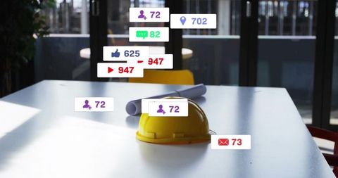 Construction hard hat resting on conference table with blueprints and social media metrics