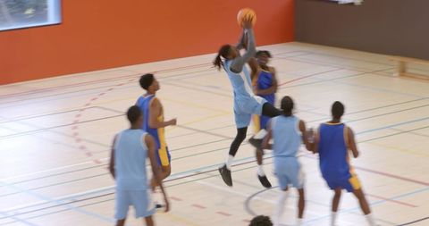 Athletic African American Basketball Player Leaping for Action