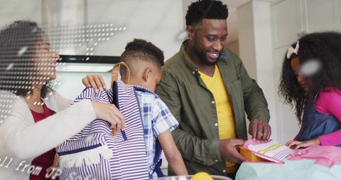 Parents preparing kids for back-to-school morning routine in bright family kitchen