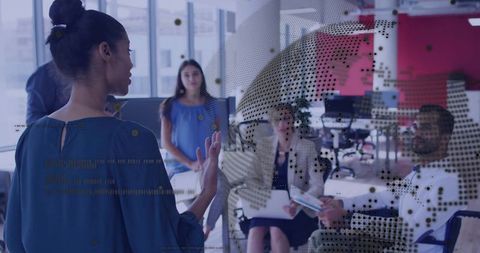 Businesswoman leading corporate meeting in modern office