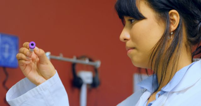 Female Laboratory Technician Examining Blood Sample in Lab - Download Free Stock Images Pikwizard.com