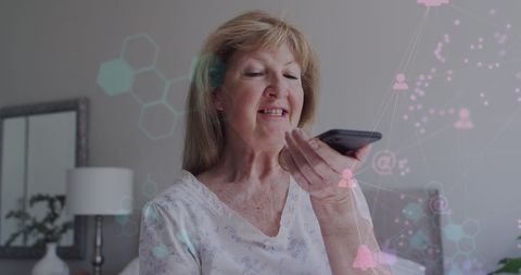 Senior Woman Using Smartphone with Data Overlay in Home Environment