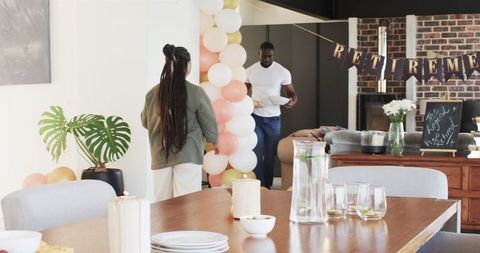Family Preparing for Retirement Celebration at Home