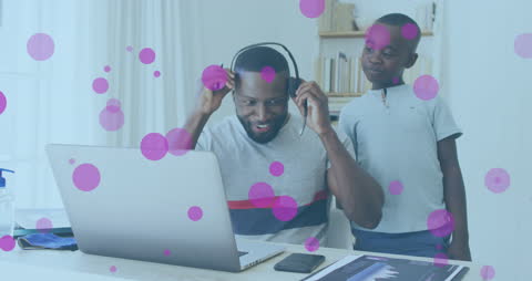 Father and Son Exploring Technology at Home