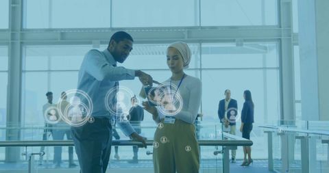 Teamwork in Modern Office with Digital Data Overlay