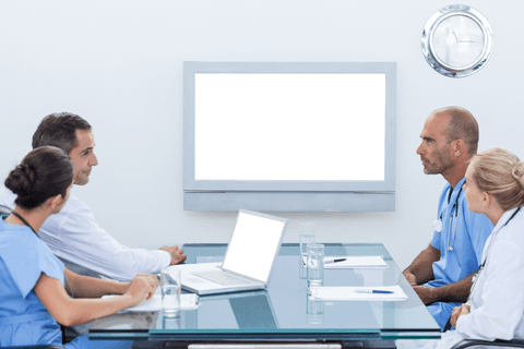 Medical Team Meeting with Blank Screen in Office Interior - Download Free Stock Videos Pikwizard.com