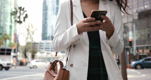 Businesswoman Using Smartphone in Urban Environment - Download Free Stock Images Pikwizard.com