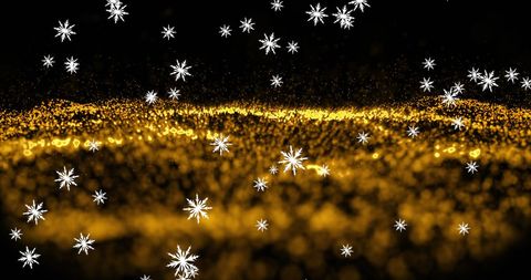 Falling Snowflakes Over Glowing Golden Waves