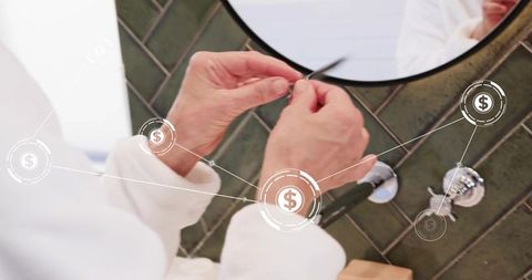 Senior woman trimming nails at bathroom sink in white robe with financial hud overlay