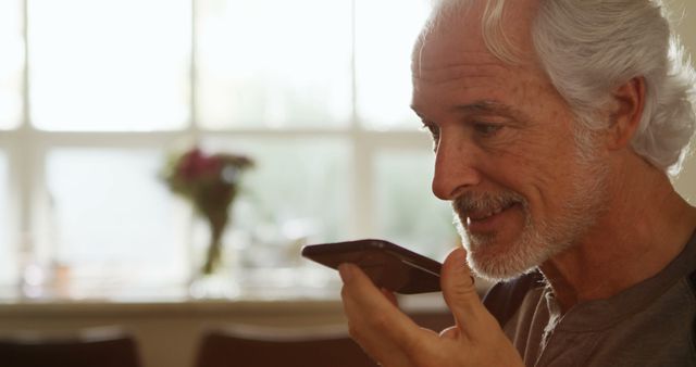 Senior Man Engaging in Voice Call at Home - Download Free Stock Images Pikwizard.com