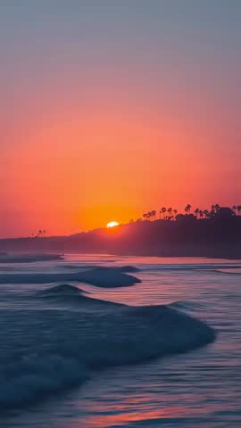 Sinking Sun Sliding Behind Palm-Lined Bluff Creating Shimmering Ocean Bands | Vertical Video