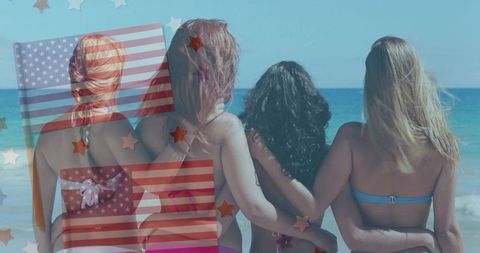 Women in bikinis celebrating unity and friendship at beach