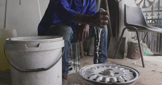 Mechanic Cleaning Rim with Soapy Water in Auto Repair Shop - Download Free Stock Images Pikwizard.com