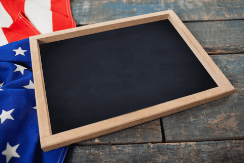Transparent chalkboard with american flag on rustic table