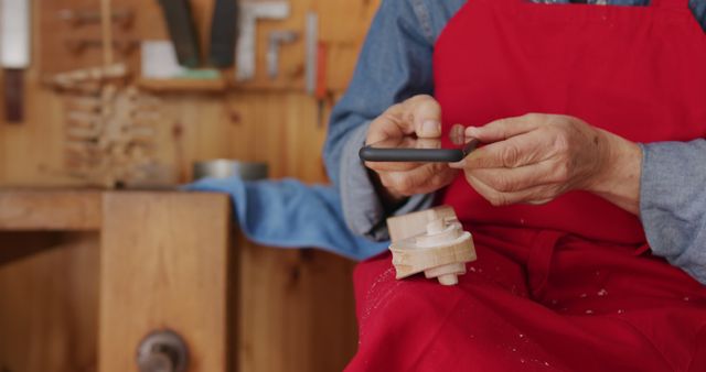 Craftsman Wearing Apron Using Smartphone in Workshop - Download Free Stock Images Pikwizard.com