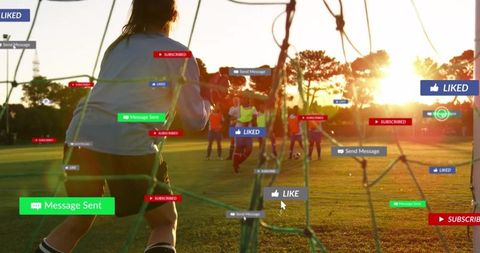 Incoming Notifications as Youth Blocks Soccer Goal at Sunset