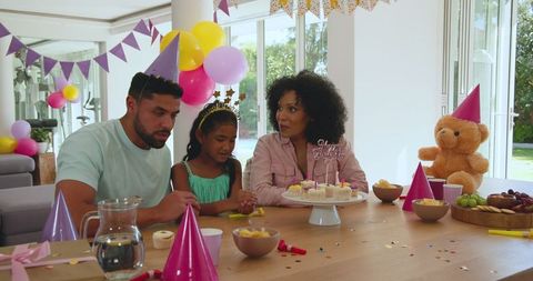 Diverse Family Celebrating Birthday in Colorful Home Setting