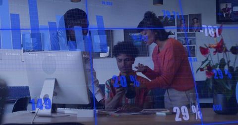 Creative Professionals Collaborating in Modern Digital Studio