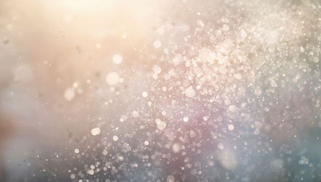 Glittering bokeh particles with warm-to-cool gradient, soft light flare and floating orbs