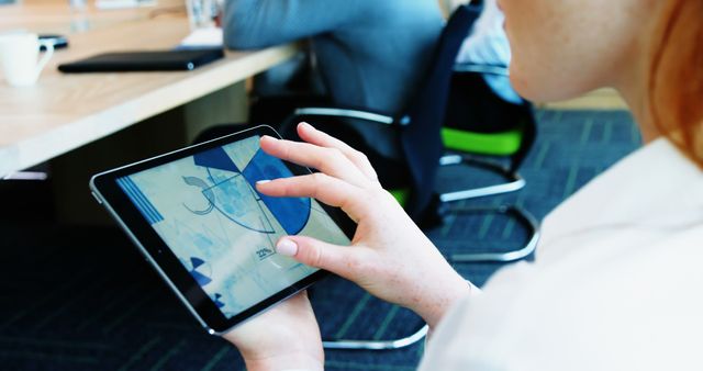 Businesswoman using tablet during meeting in office - Download Free Stock Images Pikwizard.com