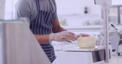 Professional hob adjust hand finely slices cheese for gourmet prep