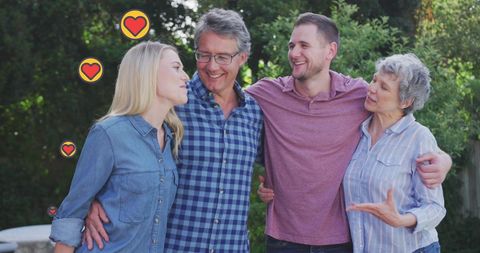 Happy Family Embracing in Sunny Outdoors with Heart Icons - Download Free Stock Images Pikwizard.com