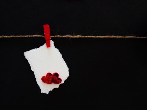 Red heart on twine with textured note