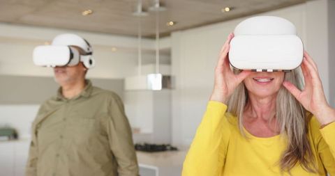 Senior Couple in Kitchen Experiencing Virtual Reality