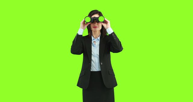 Businesswoman Searching with Binoculars Isolated on Green Background - Download Free Stock Images Pikwizard.com