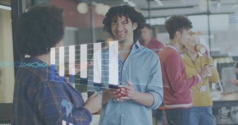 Smiling young professional holding mug in coworking space with holographic bar chart