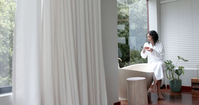 Woman Relaxing in Modern Bathroom Near Large Window - Download Free Stock Images Pikwizard.com