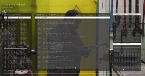Mid adult technician holding metal bar in garage workshop with cyber terminal overlay
