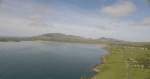tranquil coastal landscape with transparent blue sky and rolling hills - Download Free Stock Videos Pikwizard.com